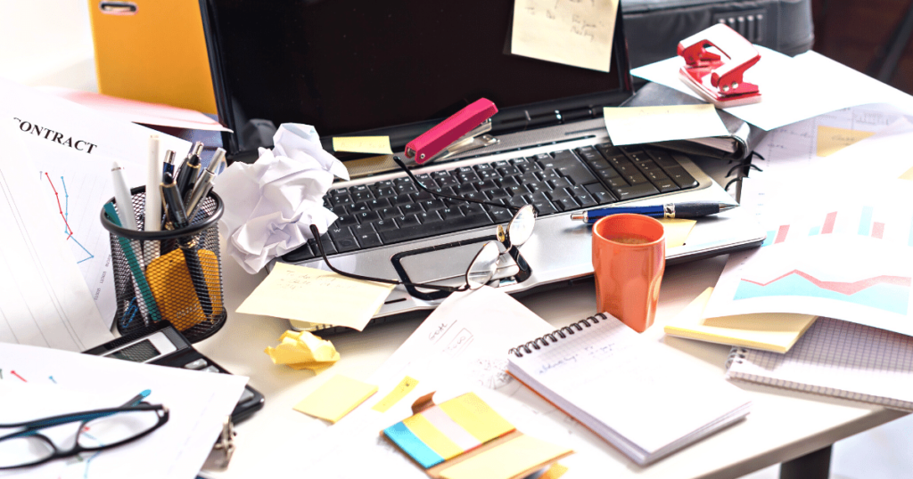 A disorganized desk to demonstrate the interview red flag of disorganization