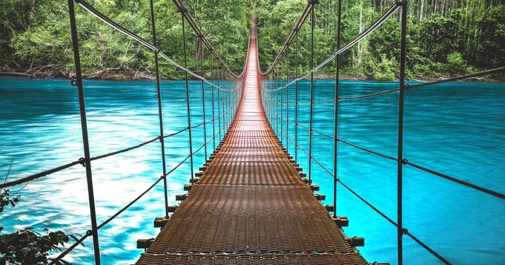 A bridge over blue water because the purpose of a cover letter is a bridge