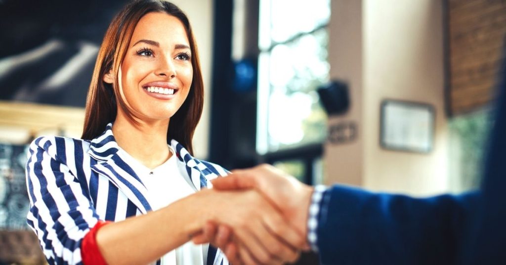 Woman shaking hands to start networking
