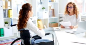 2 women having a job interview in a large office