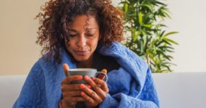 woman taking a sick day with a mug