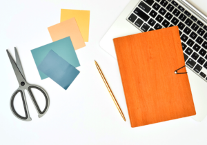 Laptop and notebook on desk for job research